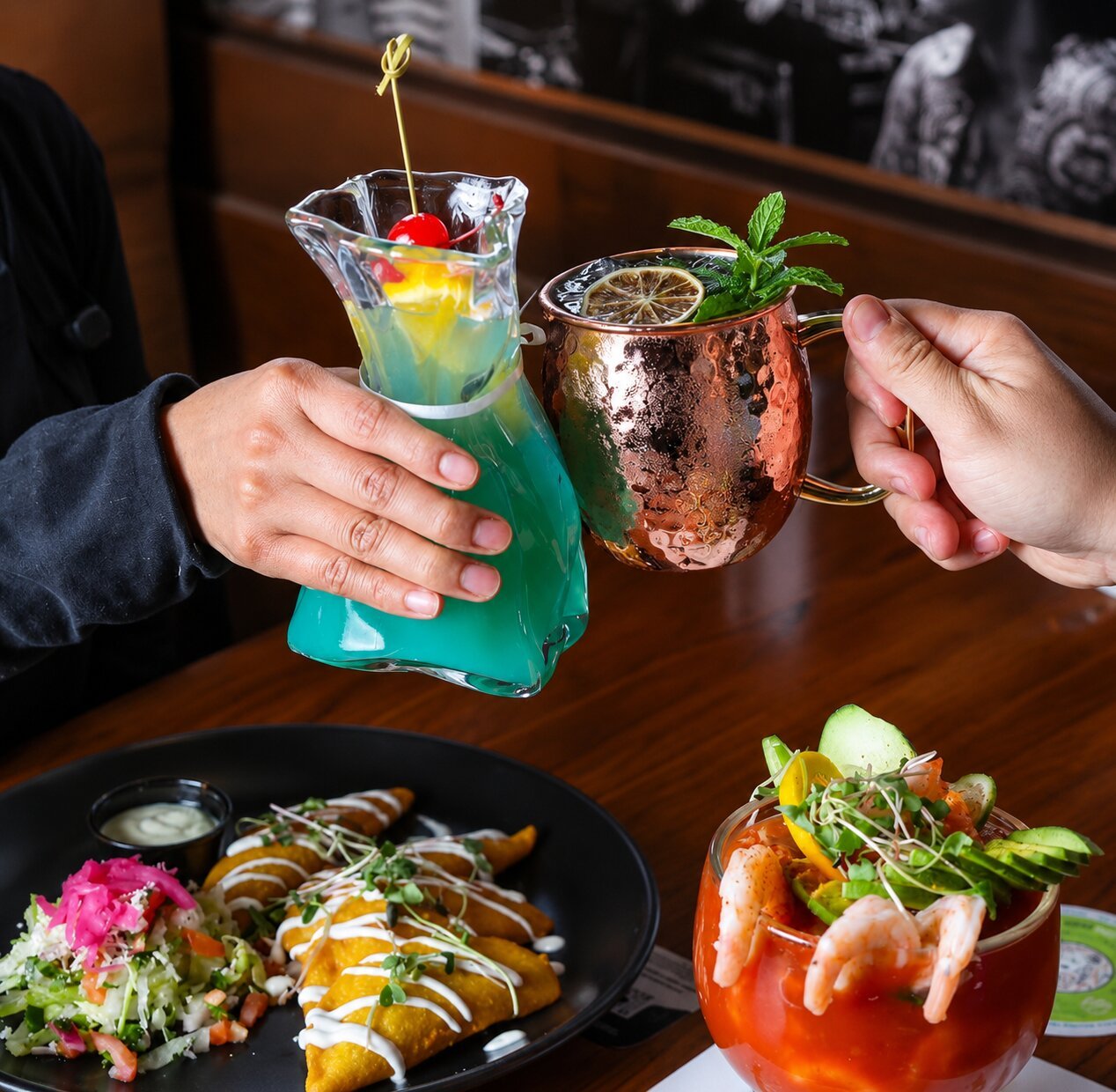 Cheers over a table at Tlaquepaque Mexican Restaurant